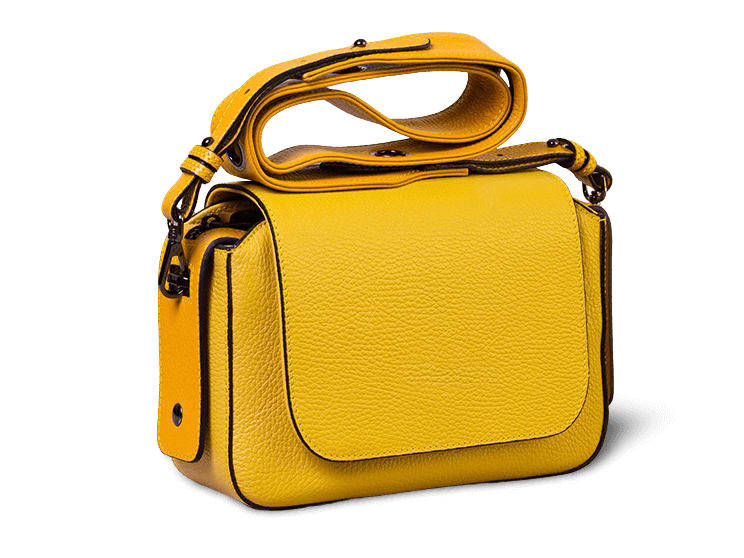 Yellow leather handbag isolated on a transparent background after AI removal