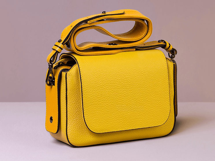 Yellow leather handbag product photo with its original studio background