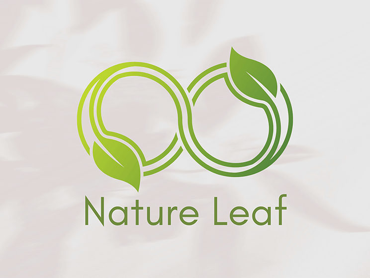 Green leaf logo on a light marble background