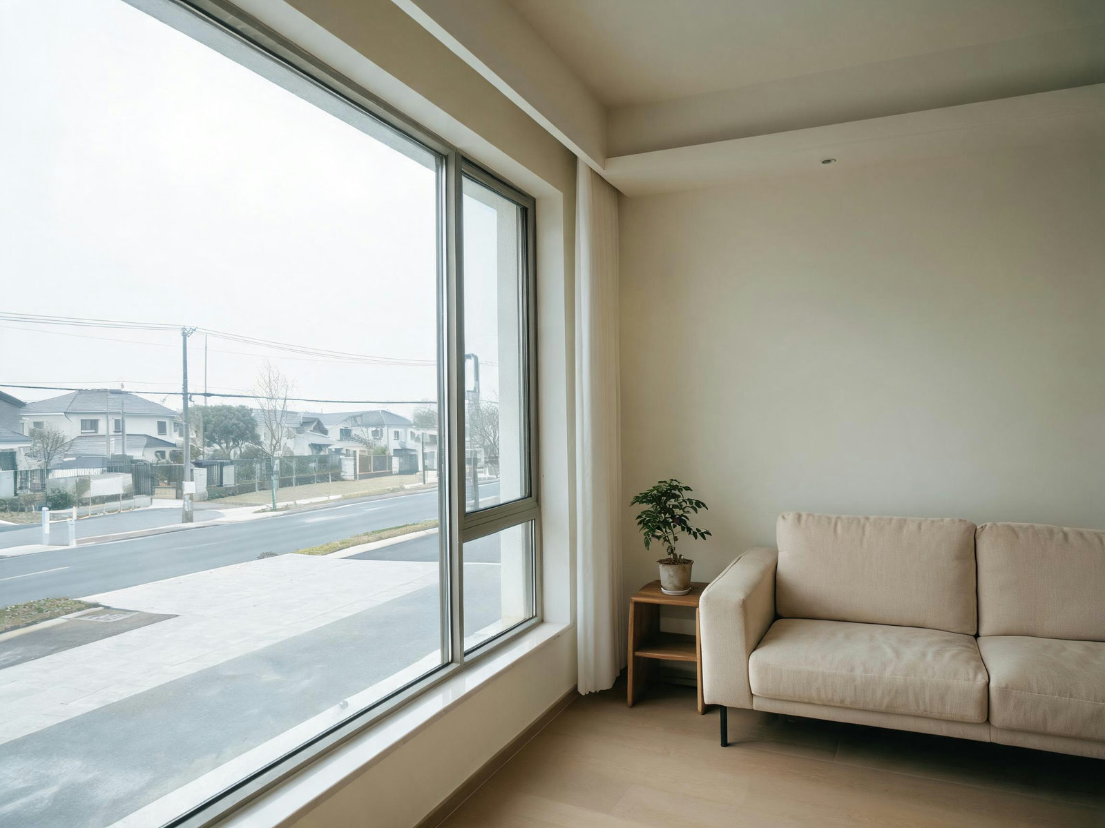 Room interior with a plain sky visible through the window