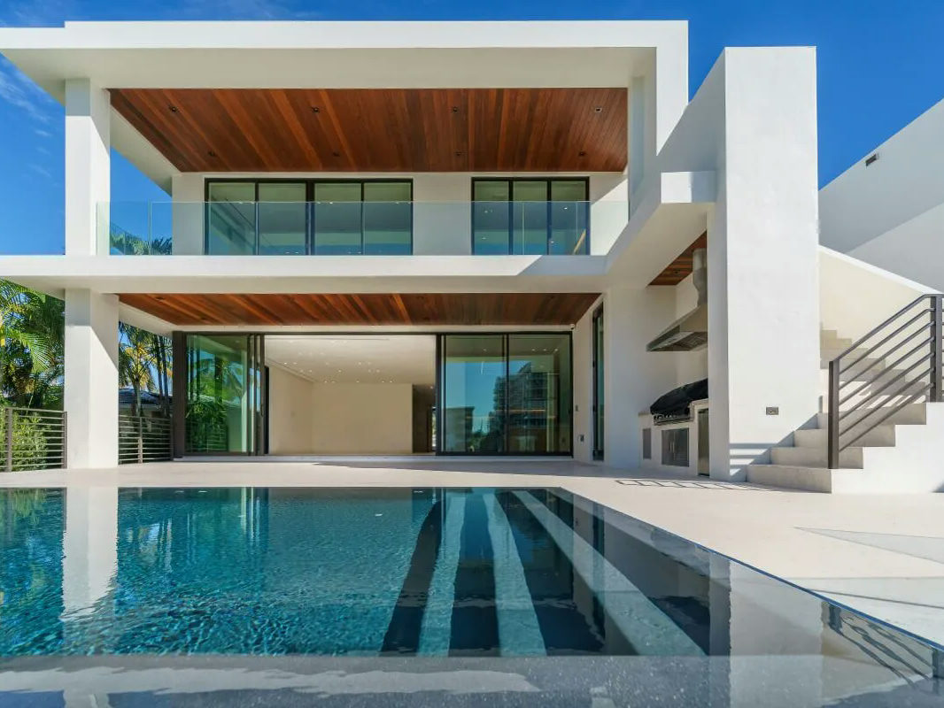 Modern villa with a pool after AI upscaling, compression artifacts rebuilt away