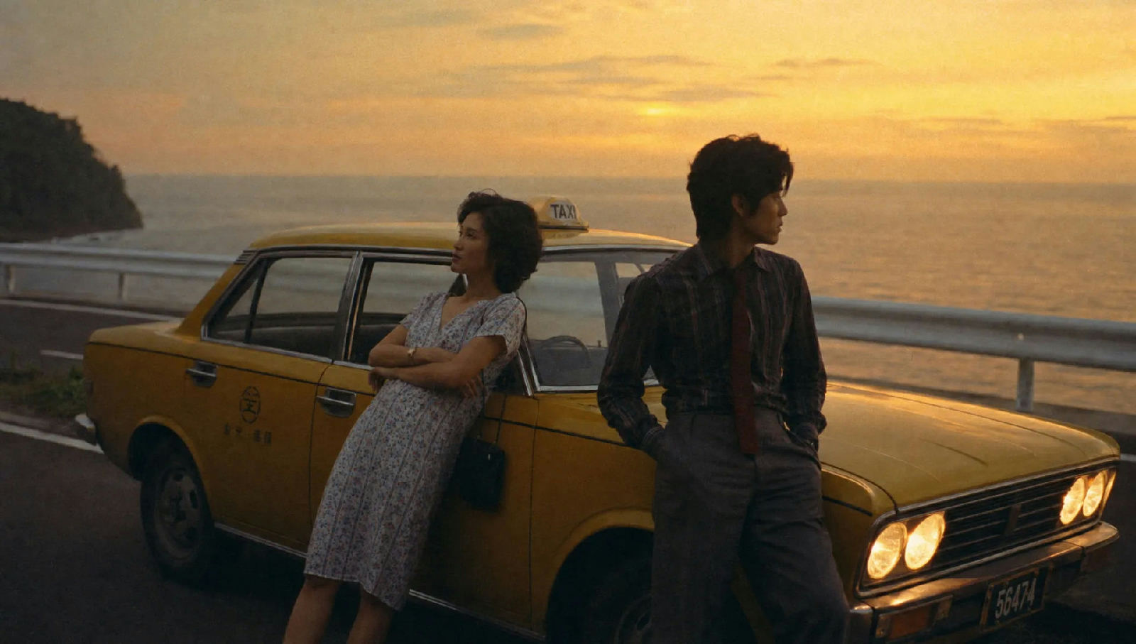 AI-generated vintage film still of a couple leaning on a yellow taxi on a coastal road at golden hour
